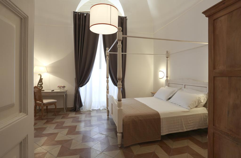 Santa Marta Suites & Apartments Лечче Номер фото