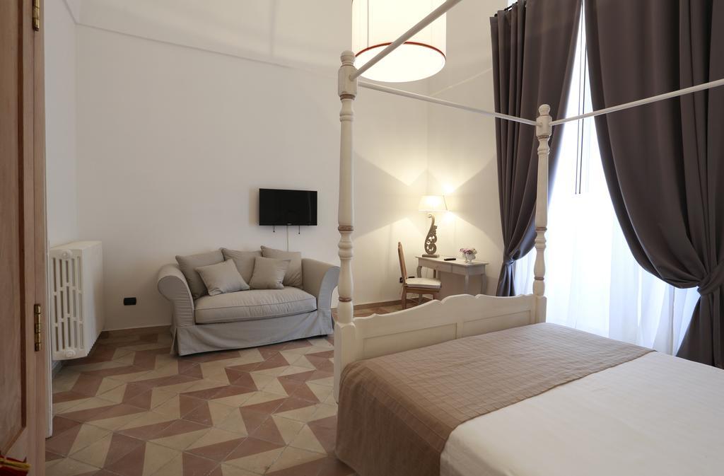 Santa Marta Suites & Apartments Лечче Номер фото